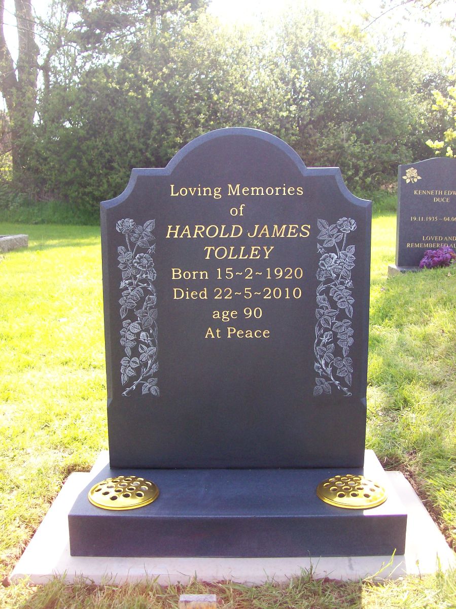 Honed Dark Grey Granite Trefoil with Checks, Sandblast Lettering in Gold with Hand Etched Flower adorning the sides